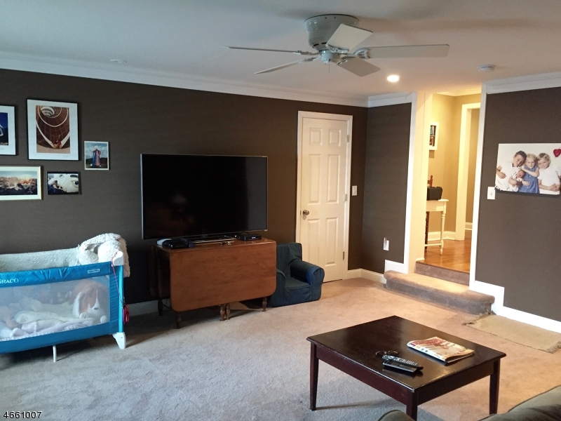 2 Spring Street Far Hills, NJ 07931 - Photo 13 of 16 a living room with furniture and a flat screen tv