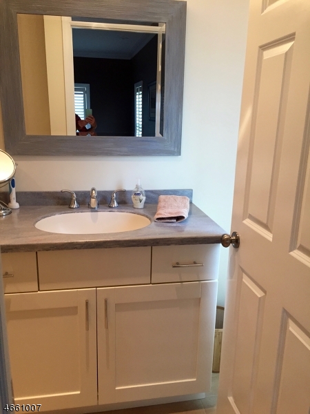 2 Spring Street Far Hills, NJ 07931 - Photo 15 of 16 a bathroom with a sink and a mirror