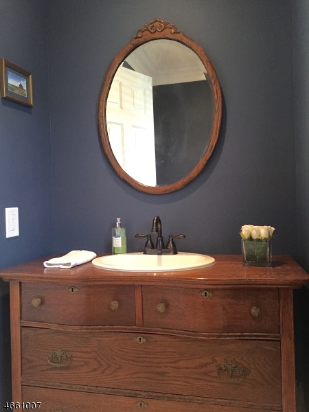 2 Spring Street Far Hills, NJ 07931 - Photo 16 of 16 a bathroom with a sink and a mirror