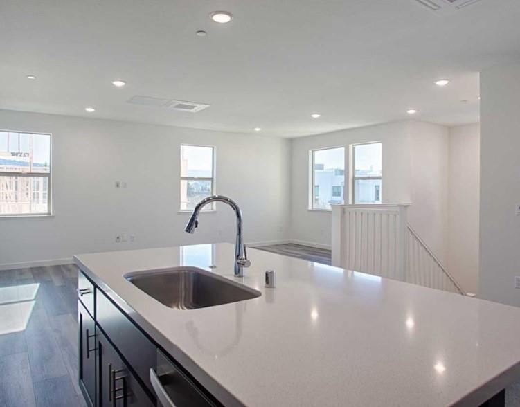 6625 Optimum Loop San Jose, CA 95119 - Photo 9 of 17 a kitchen with a sink and chandelier