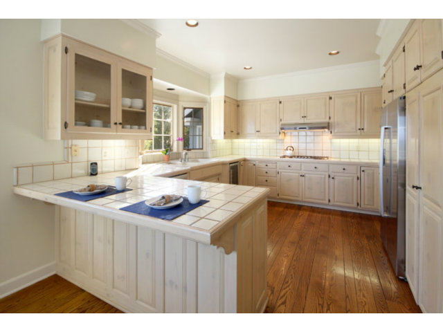 1212 Laurent Street Santa Cruz, CA 95060 - Photo 15 of 25 a kitchen with granite countertop a sink and cabinets