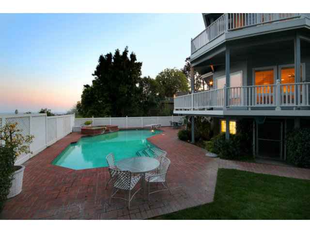1212 Laurent Street Santa Cruz, CA 95060 - Photo 4 of 25 a backyard of a house with table and chairs