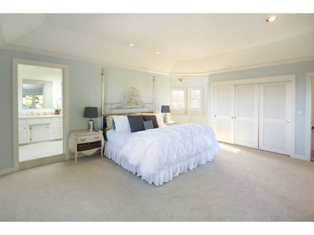 1212 Laurent Street Santa Cruz, CA 95060 - Photo 7 of 25 a spacious bedroom with a bed and a cabinets