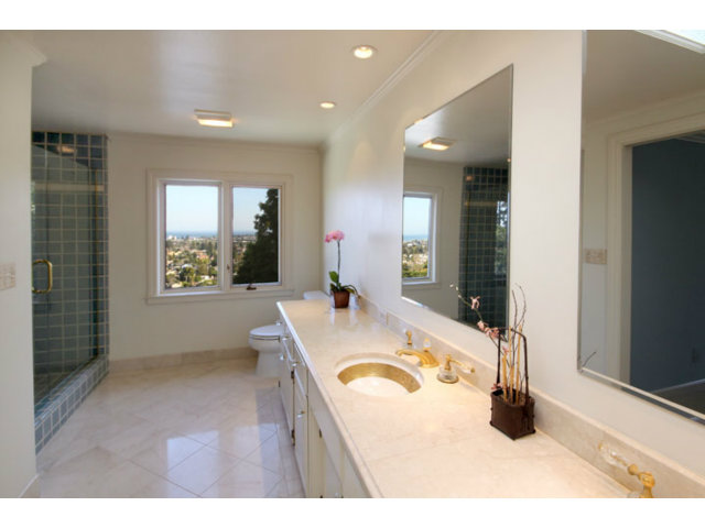 1212 Laurent Street Santa Cruz, CA 95060 - Photo 8 of 25 a bathroom with a tub sink and mirror
