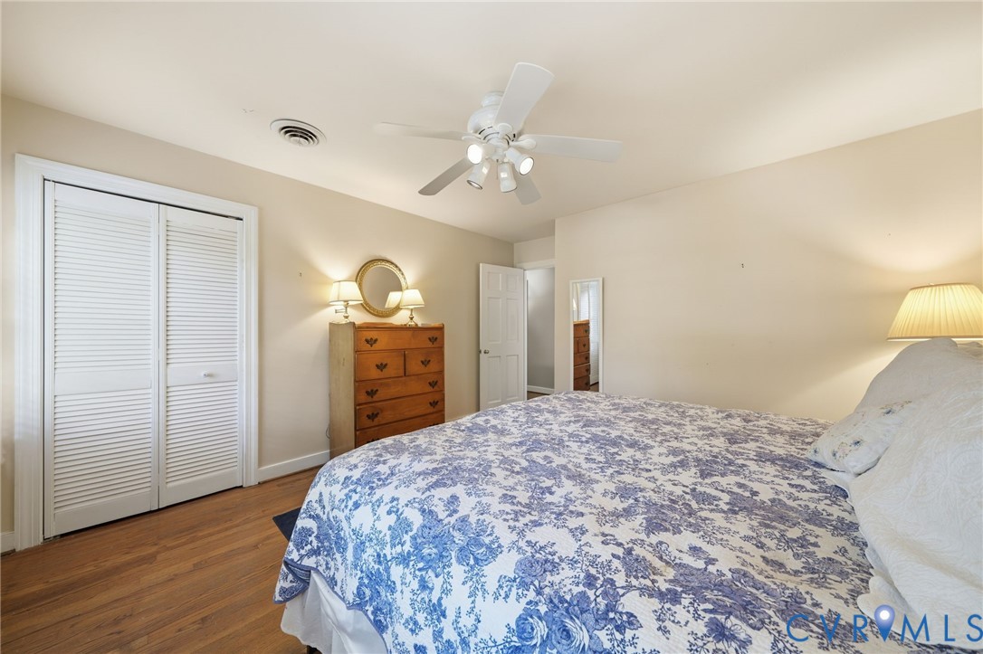 2101 Castlebridge Road Midlothian, VA 23113 - Photo 25 of 37 a bedroom with a bed and a chandelier