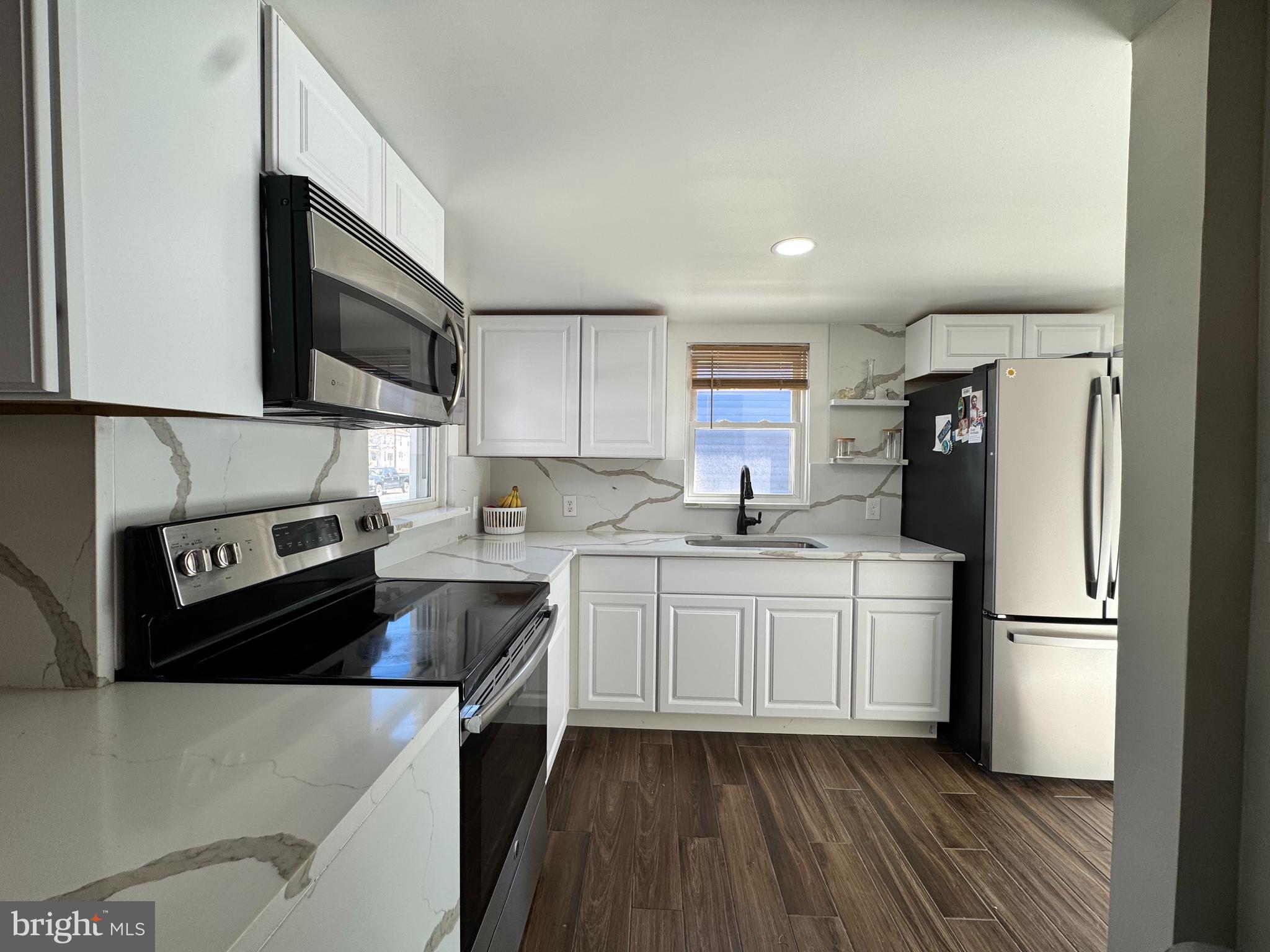 1012 Phillips Avenue Salisbury, MD 21804 - Photo 11 of 33 a kitchen with stainless steel appliances a refrigerator sink and microwave