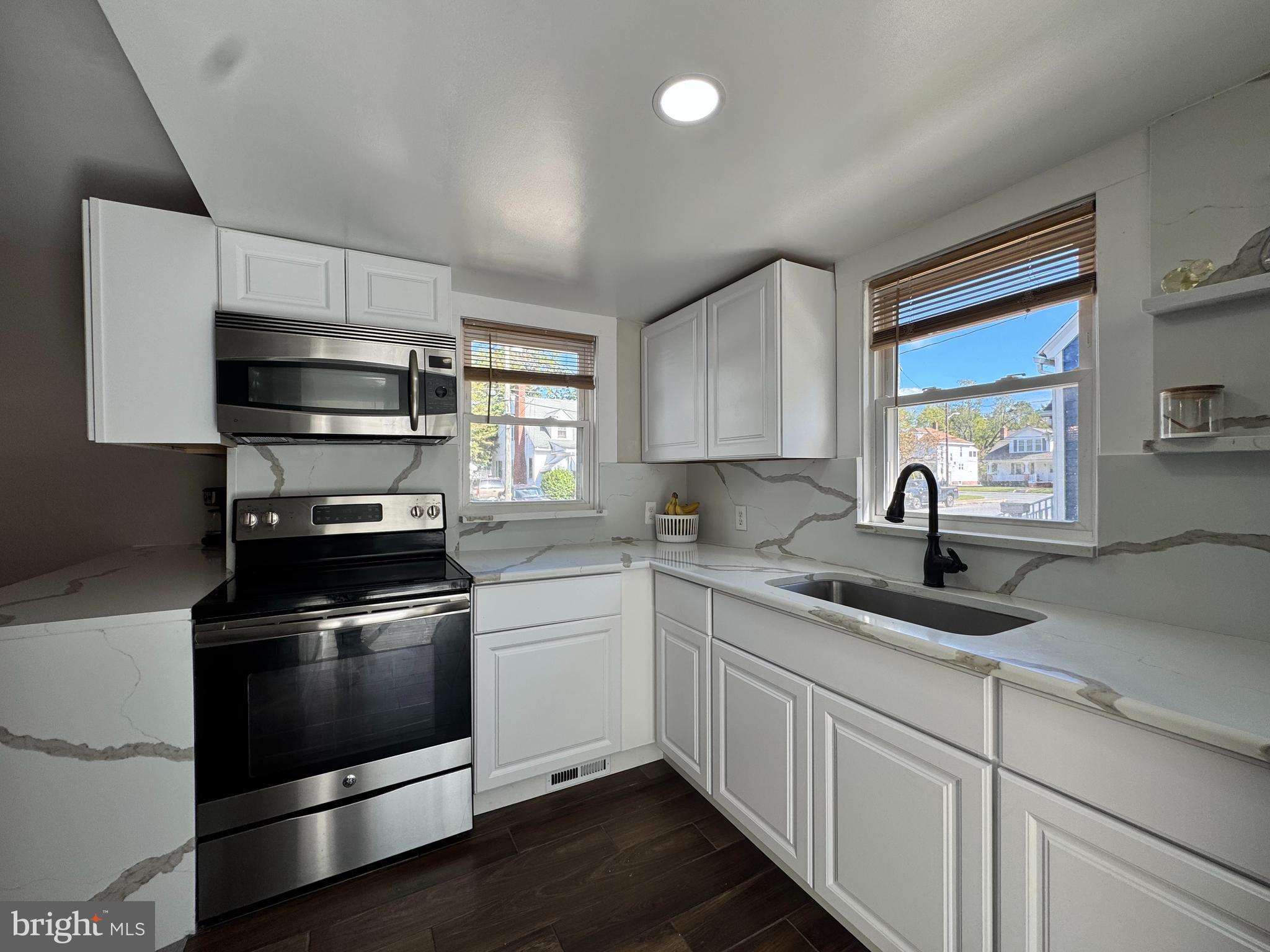 1012 Phillips Avenue Salisbury, MD 21804 - Photo 15 of 33 a kitchen with sink a microwave and cabinets