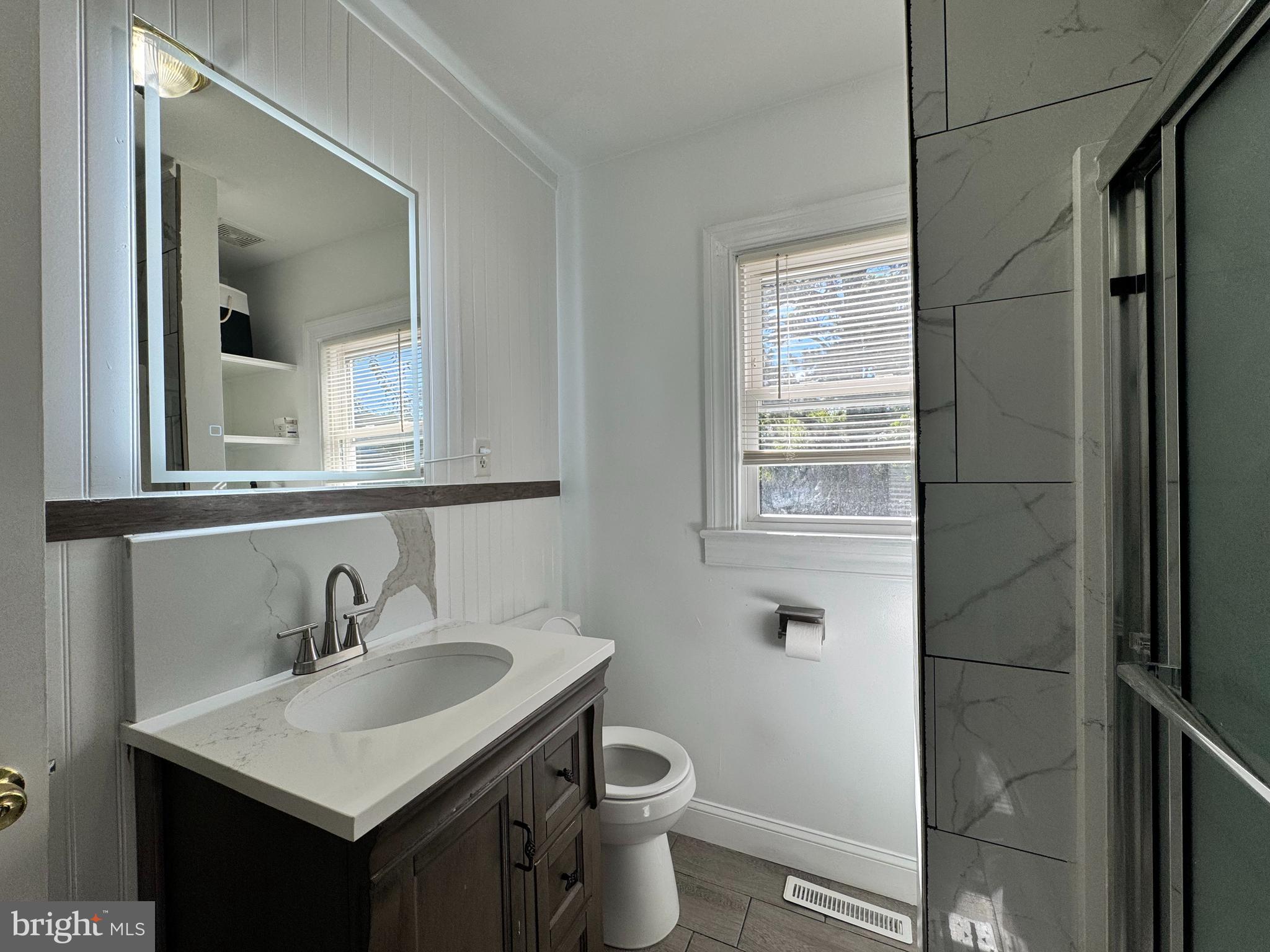 1012 Phillips Avenue Salisbury, MD 21804 - Photo 21 of 33 a bathroom with a sink toilet and a mirror