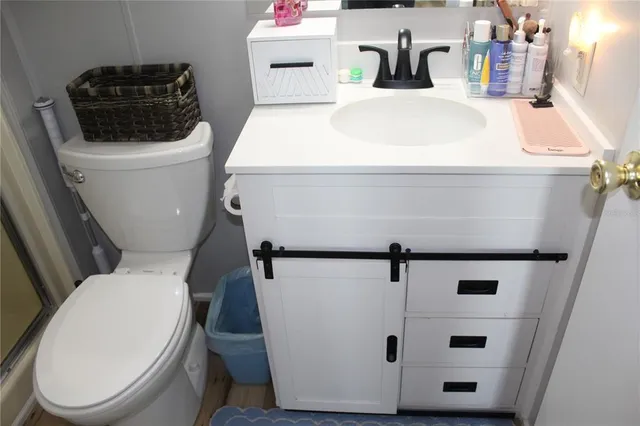 a bathroom with a toilet and a sink