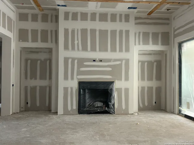 a view of a hallway with wooden shelves