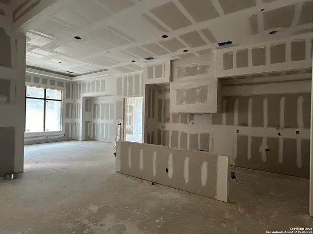 a view of empty room with a fireplace