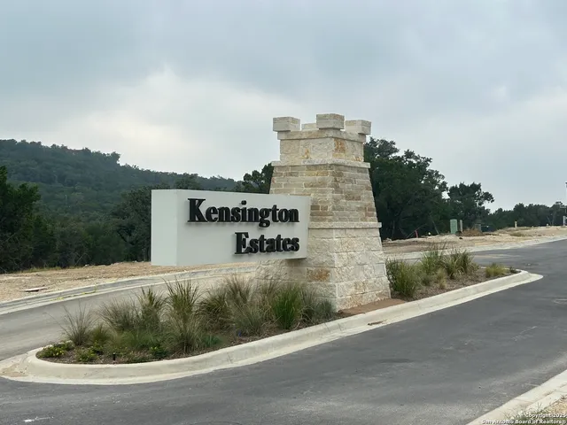 a bathroom with a double vanity sink toilet and a mirror