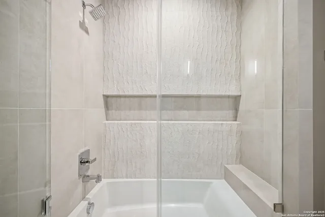 a view of a living room with lots of books