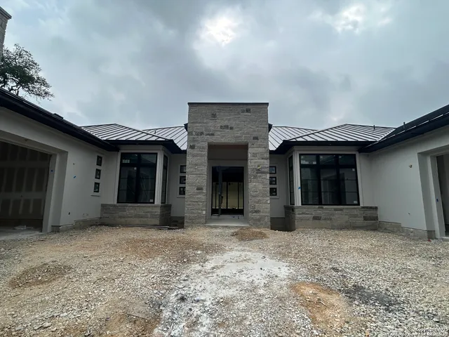 a view of a house with a large window