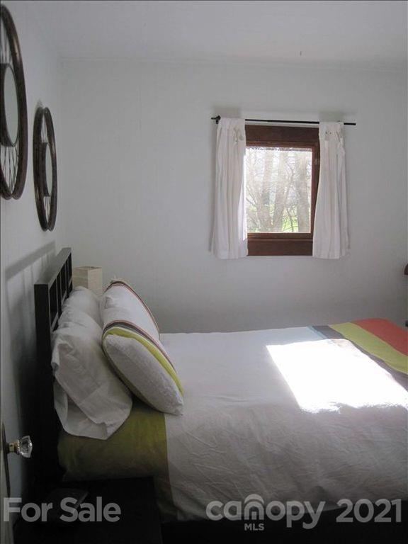 1 Rabbit Road Canton, NC 28716 - Photo 11 of 15 a bedroom with a bed and a window