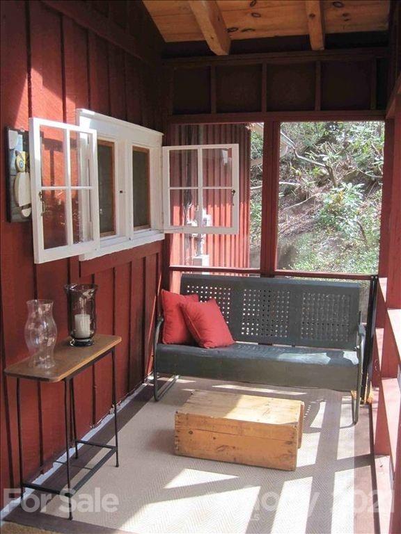 1 Rabbit Road Canton, NC 28716 - Photo 4 of 15 a view of a porch with wooden floor
