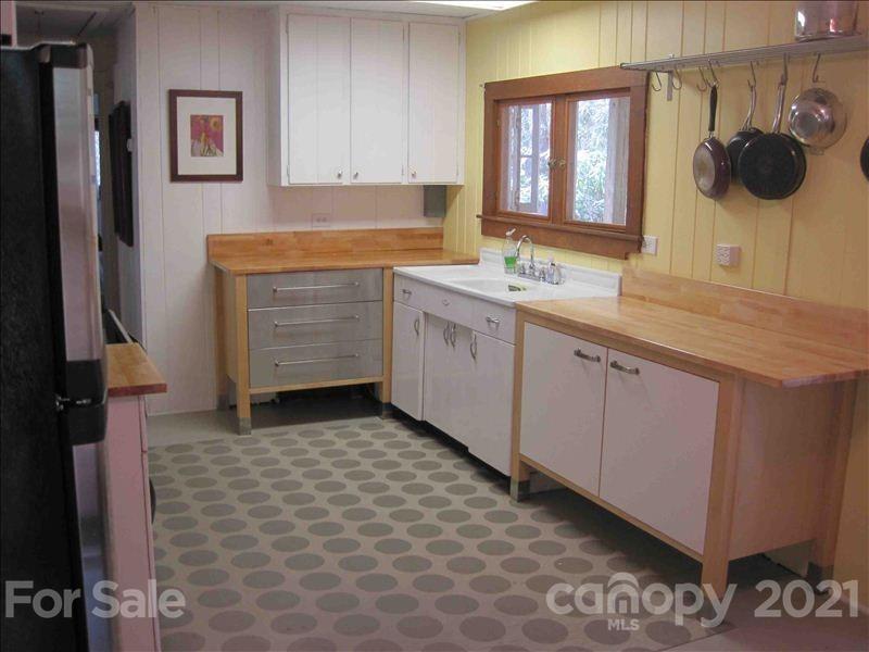 1 Rabbit Road Canton, NC 28716 - Photo 9 of 15 a kitchen with a sink and cabinets