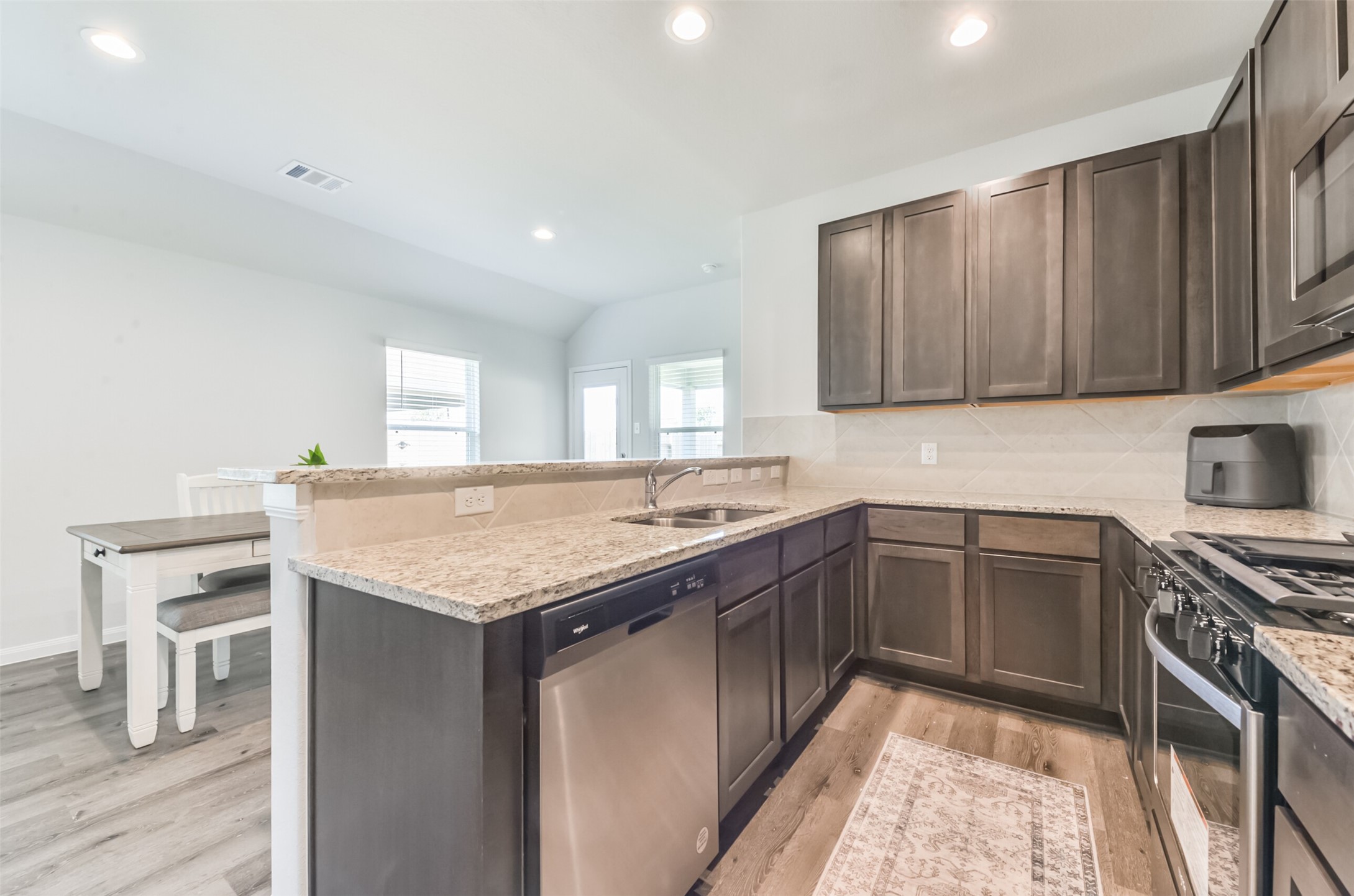 5522 Briana Dee Drive Rosharon, TX 77583 - Photo 15 of 37 a kitchen with a sink and cabinets