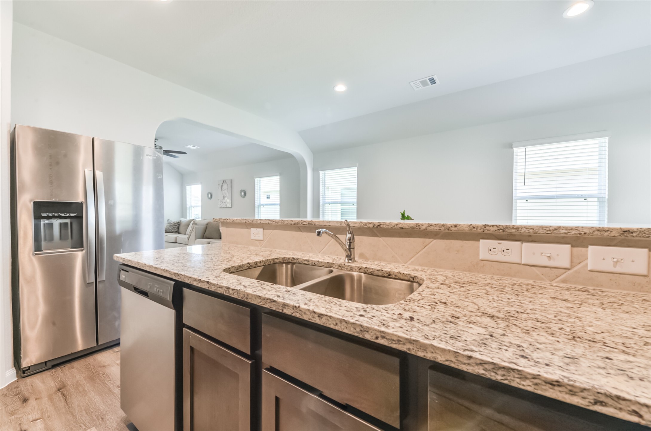 5522 Briana Dee Drive Rosharon, TX 77583 - Photo 16 of 37 a kitchen with granite countertop a sink and a refrigerator