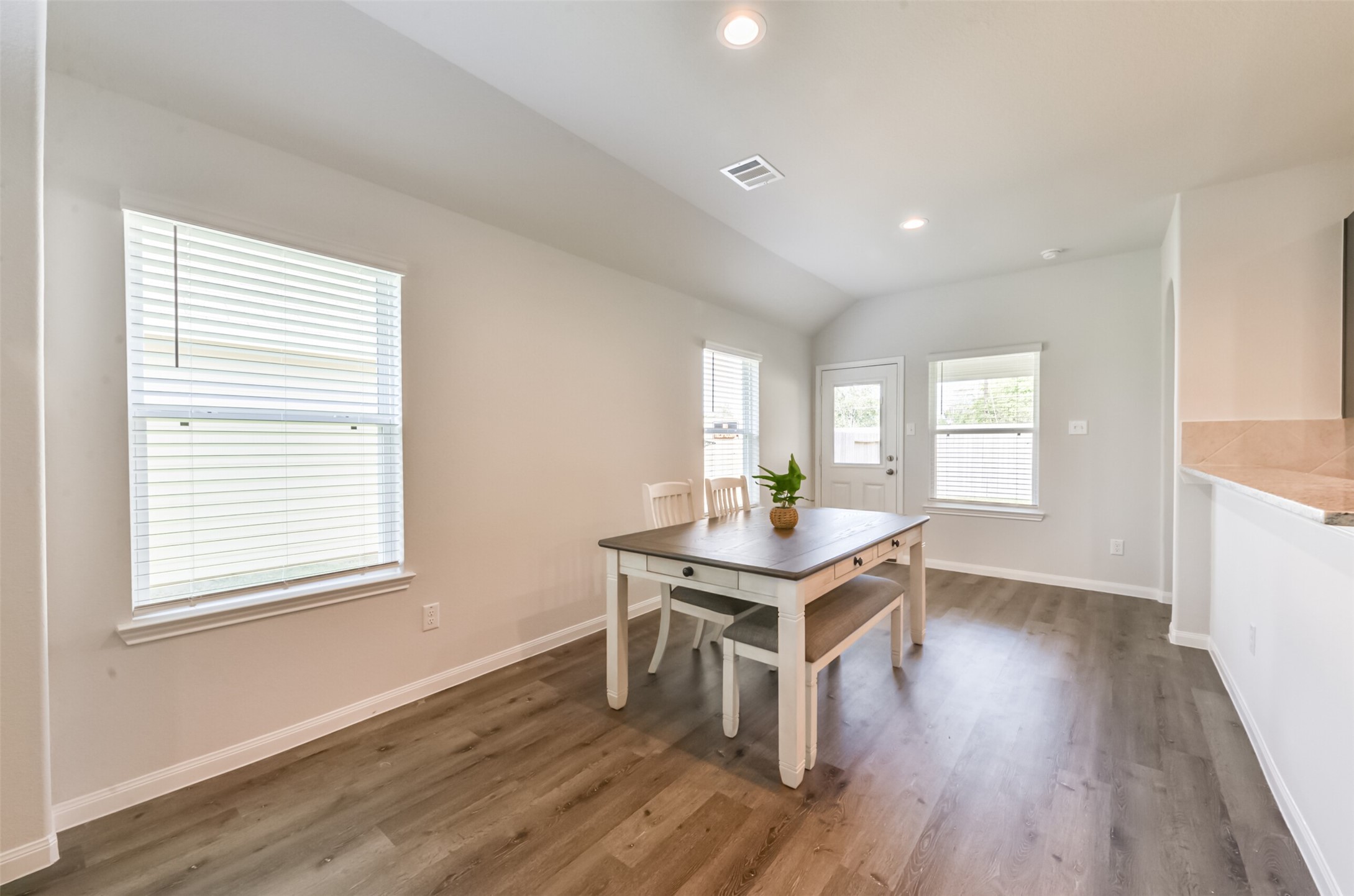 5522 Briana Dee Drive Rosharon, TX 77583 - Photo 19 of 37 a view of a kitchen that shows a sink wooden floor and a kitchen