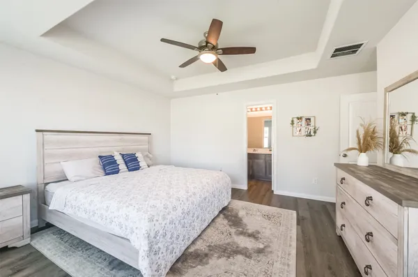 a bedroom with a bed and a dresser