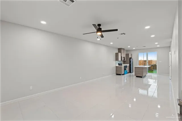 a view of a kitchen with a sink and a microwave