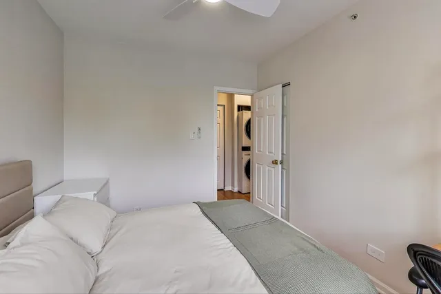 a bedroom with a bed and a couch