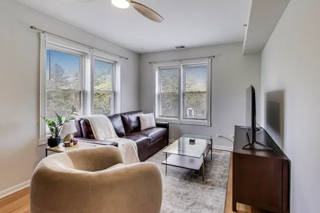 a living room with furniture and a window
