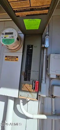 a view of a white house with a yard covered in snow