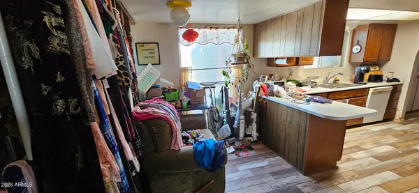 a view of a kitchen with fridge and workspace