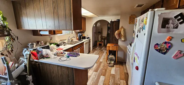 a view of a kitchen with appliances and cabinets