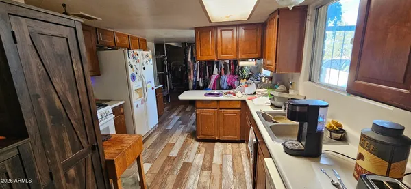 a view of a kitchen with furniture and a window