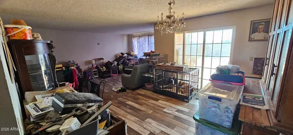 a very nice looking room with many windows and furniture