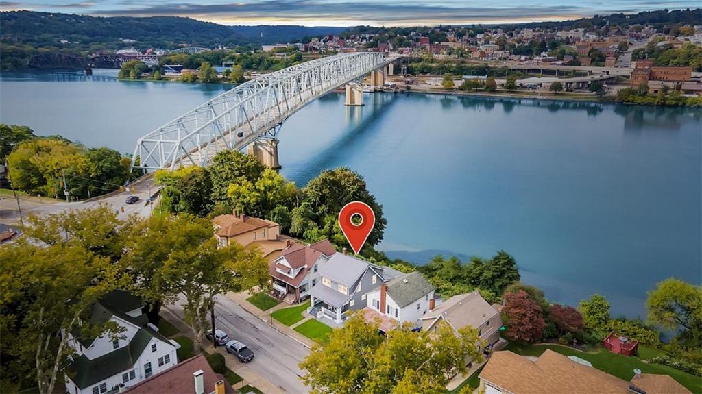 an aerial view of a house with a lake view