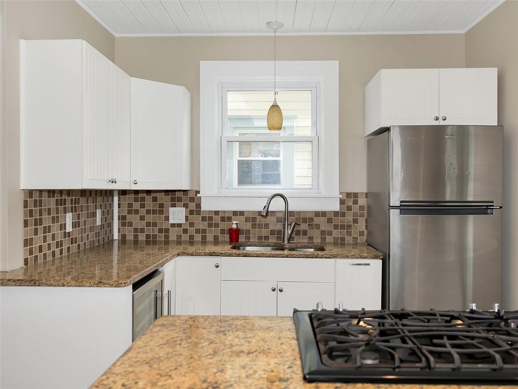 919 Atlantic Avenue Monaca, PA 15061 - Photo 11 of 25 a kitchen with a refrigerator and a sink