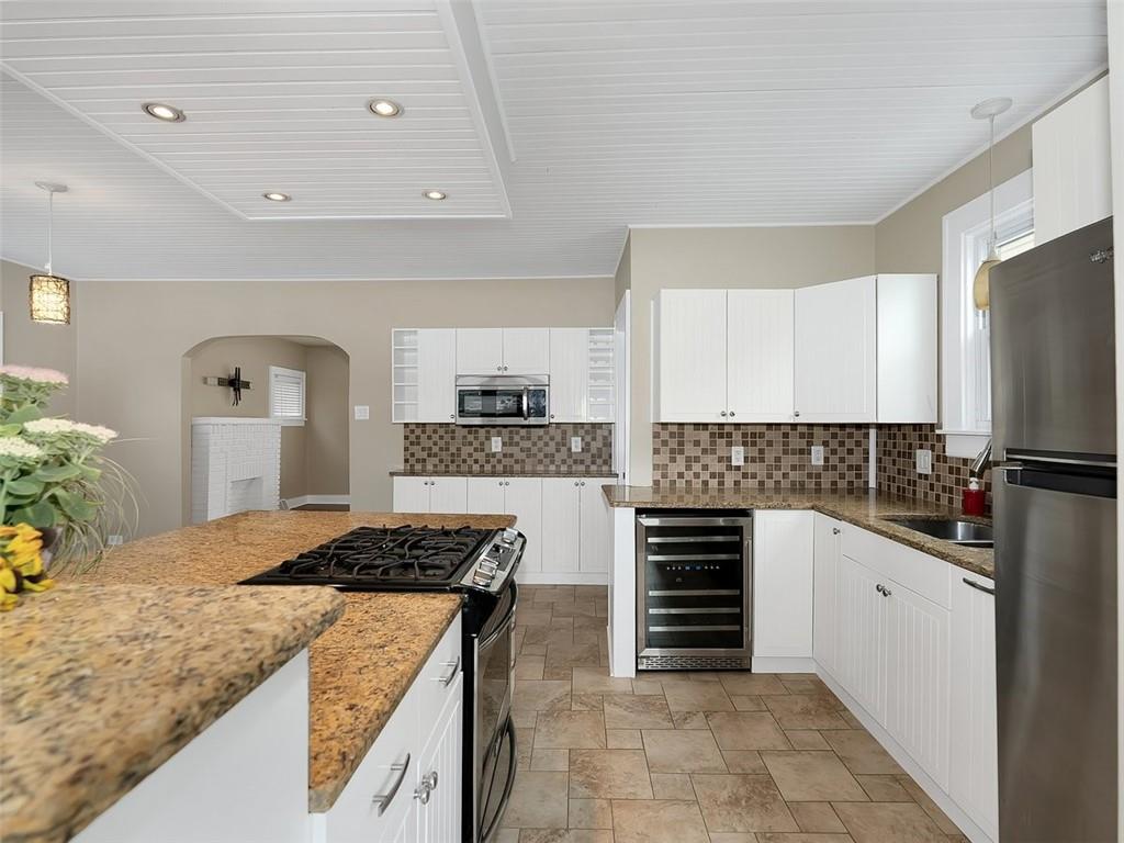 919 Atlantic Avenue Monaca, PA 15061 - Photo 14 of 25 a kitchen with granite countertop a sink and cabinets