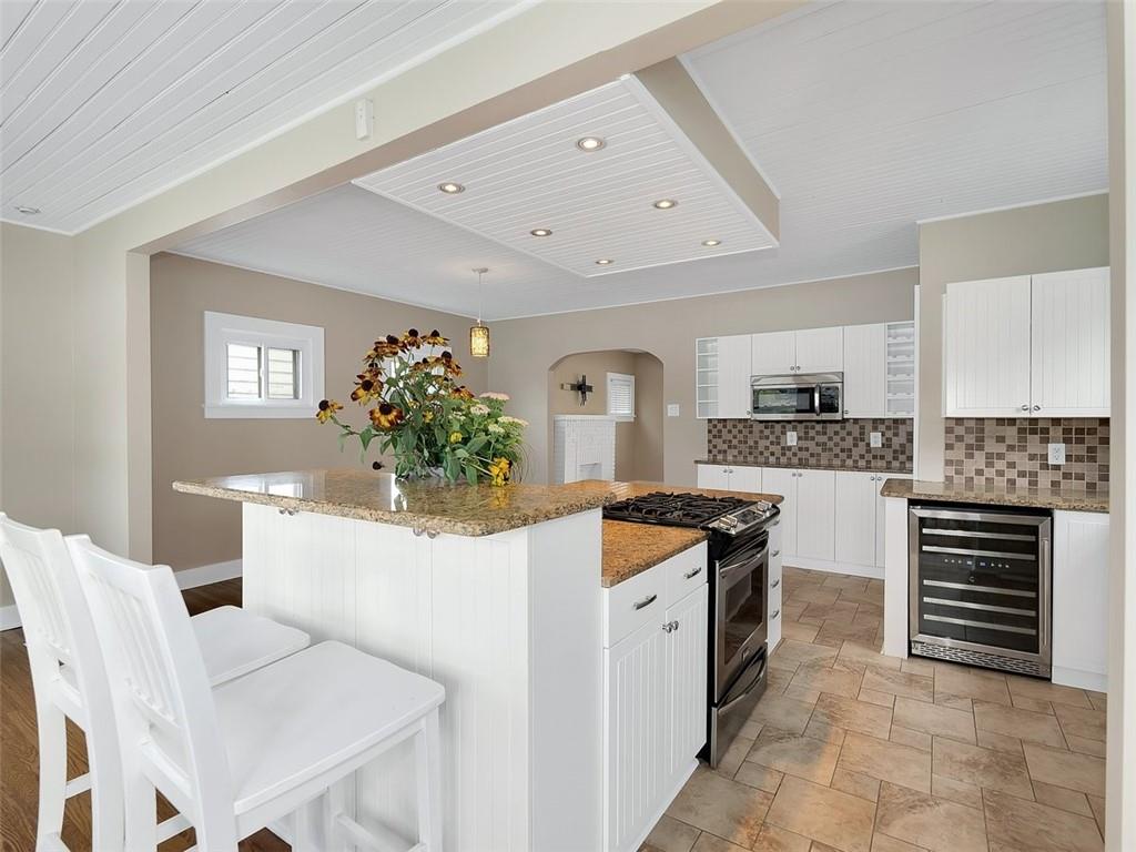 919 Atlantic Avenue Monaca, PA 15061 - Photo 15 of 25 a kitchen with cabinets and chairs