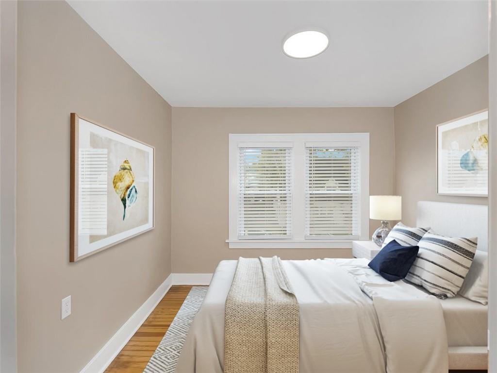 919 Atlantic Avenue Monaca, PA 15061 - Photo 21 of 25 a bedroom with a bed and a window