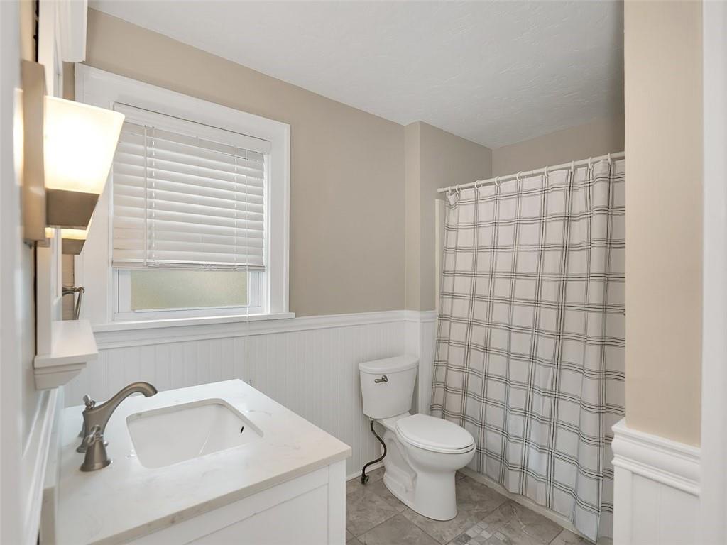 919 Atlantic Avenue Monaca, PA 15061 - Photo 22 of 25 a bathroom with a sink toilet and shower