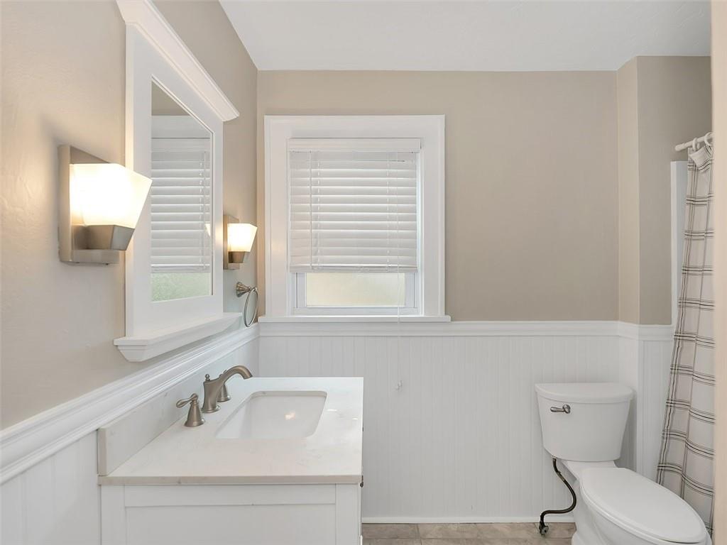 919 Atlantic Avenue Monaca, PA 15061 - Photo 23 of 25 a bathroom with a sink a toilet and mirror