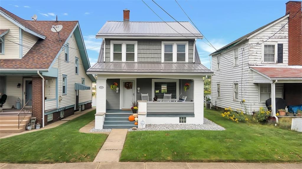 919 Atlantic Avenue Monaca, PA 15061 - Photo 25 of 25 a front view of a house with a yard
