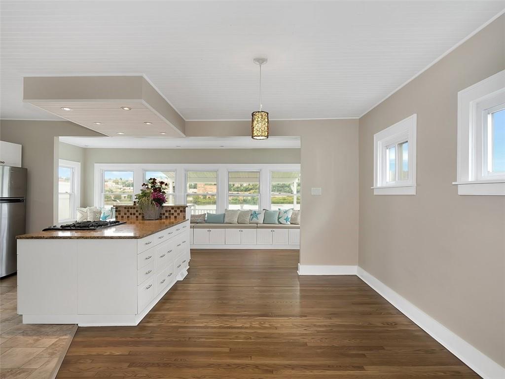 919 Atlantic Avenue Monaca, PA 15061 - Photo 9 of 25 a kitchen with granite countertop a stove and wooden floor