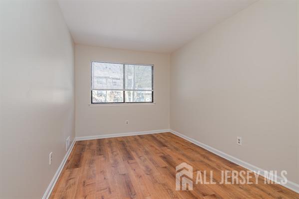 92 Reynolds Court, Unit 147 Old Bridge, NJ 07747 - Photo 15 of 19 an empty room with a window