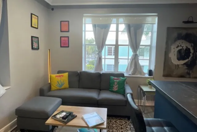 a living room with furniture and a window