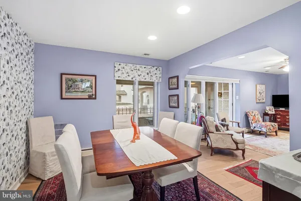 a living room with furniture a table and a flat screen tv