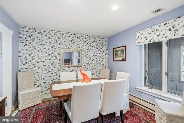 a living room with a couch and a rug