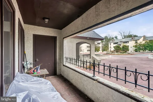 a view of swimming pool with an outdoor seating