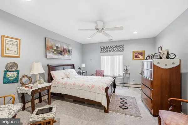 a bedroom with a bed furniture and window