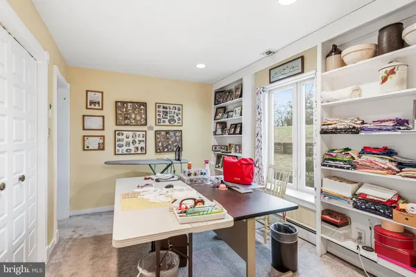 a view of a dining room with furniture and rug