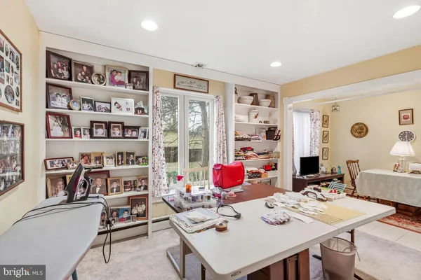 a view of a workspace with furniture and toys